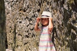 Girl in narrow stone walkway
