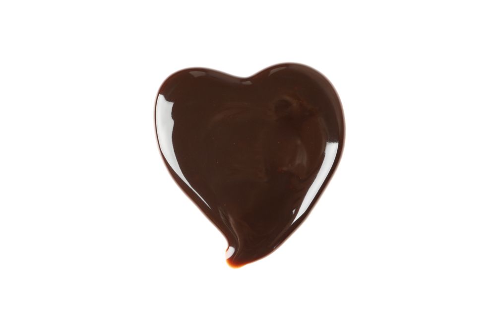 Tasty chocolate in the heart form isolated on blank background