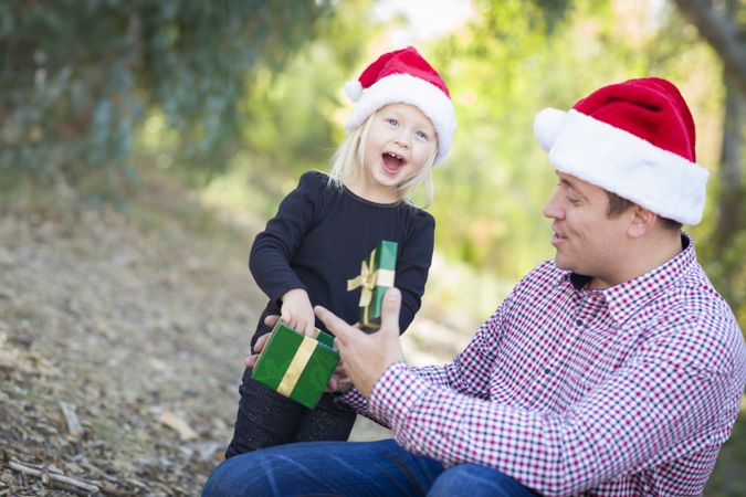 Father Giving Young Daughter Christmas Gift