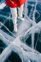 Woman skating on frozen river