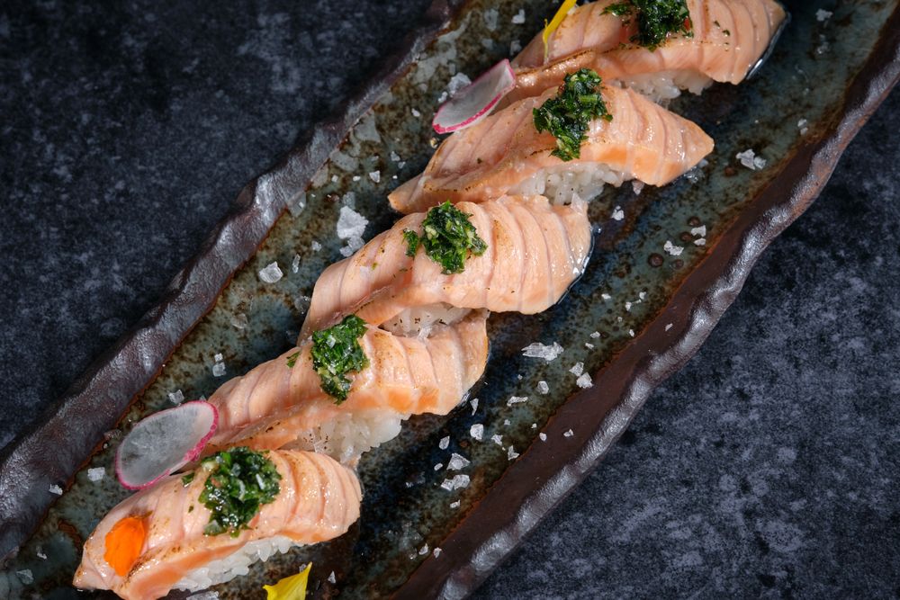 Delicious sushi served on plate in restaurant