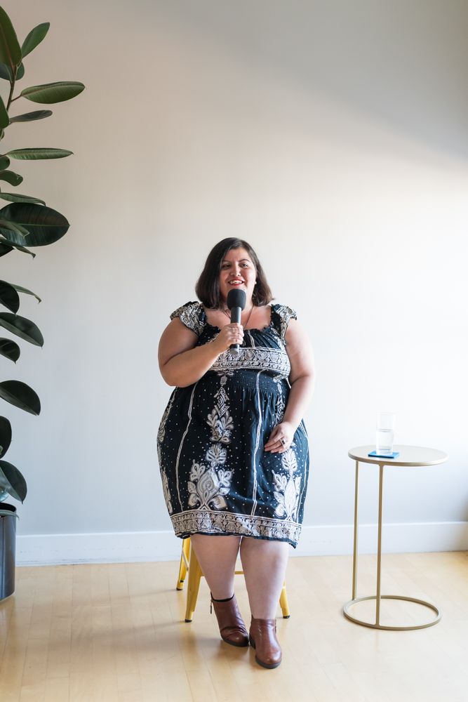 Woman speaking with a microphone
