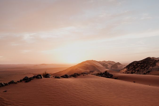 Sunset sky over hills in desert