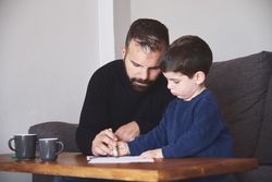 Father and son drawing together