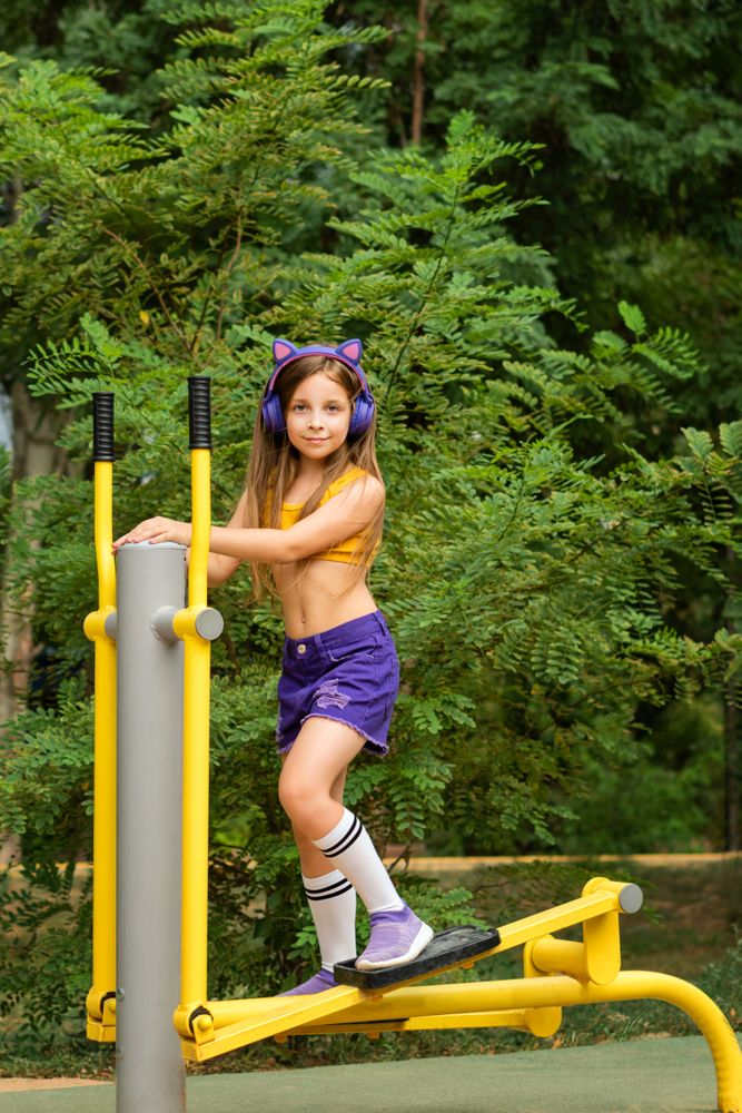 Schoolgirl works out on sports ground
