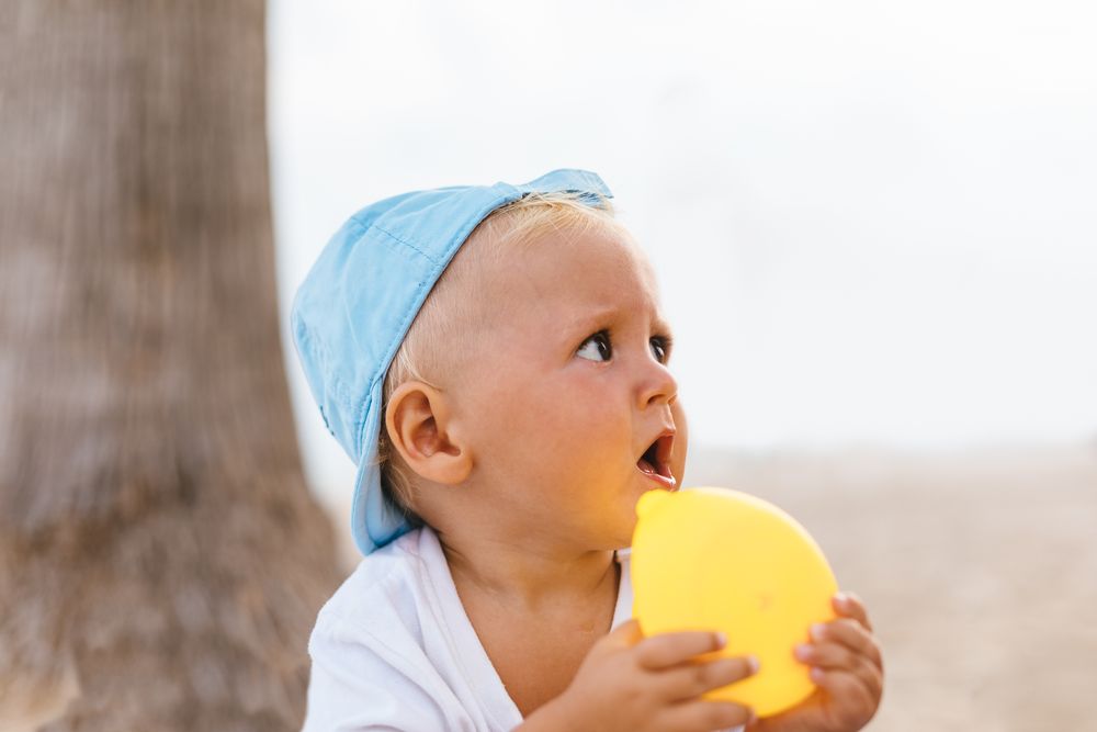 Baby boy playing with rubber ducks