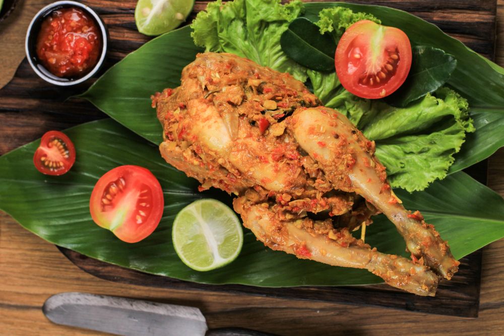 Balinese Roast Chicken Stuffed with Cassava Leaves.
