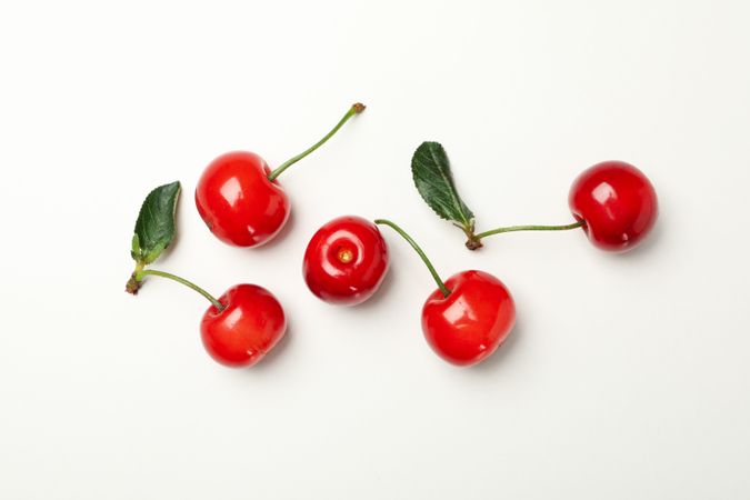 Fresh red cherry on plain background, top view