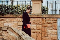 Young woman with book on steps
