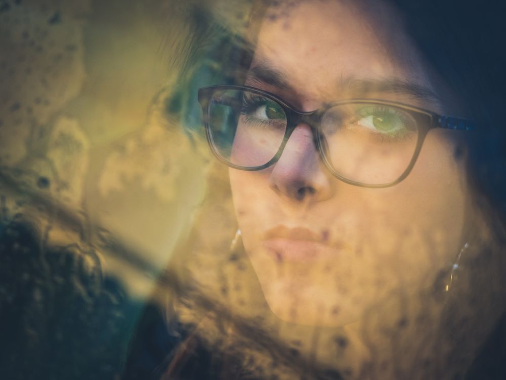Woman in eyeglasses and earrings