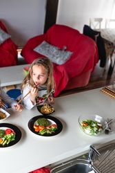 Girl eating vegan food at home