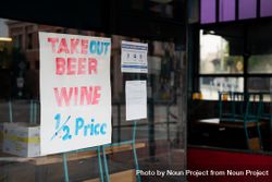 Sign showing discounted wine and beer from restaurant during quarantine 56G1l4