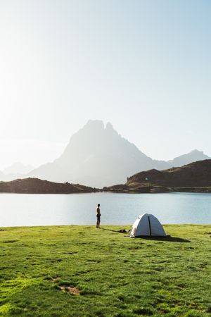Man near the tent in the mountain