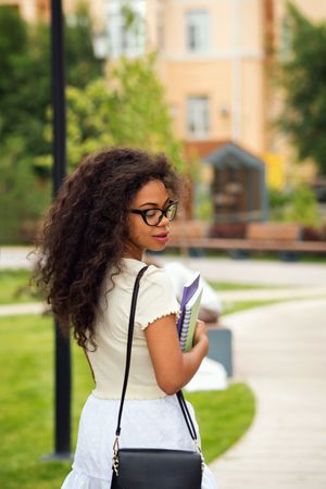 Back of young Black female student