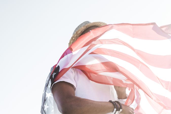 Cheerful black man with American flag