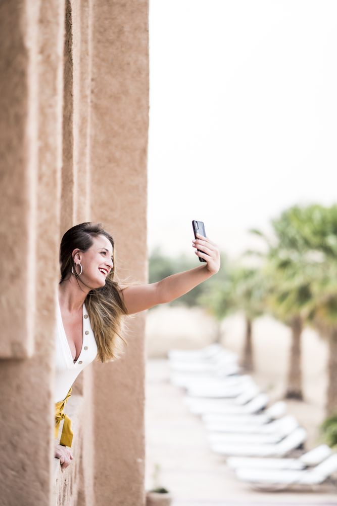 Woman making a selfie in balcony