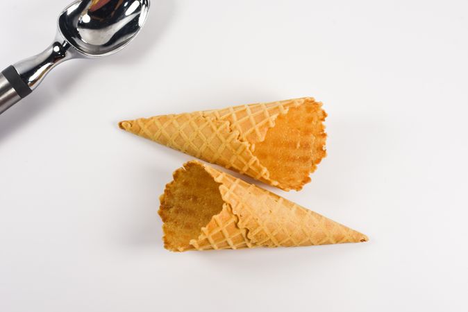 Top view of two waffle cones lying on table