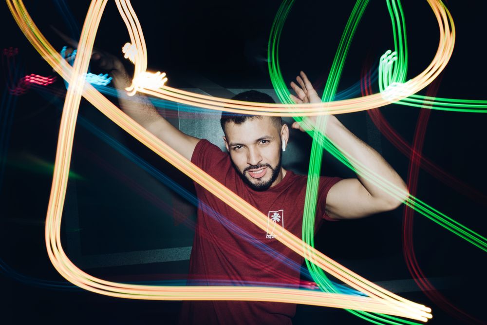 bearded man dancing in spotlight