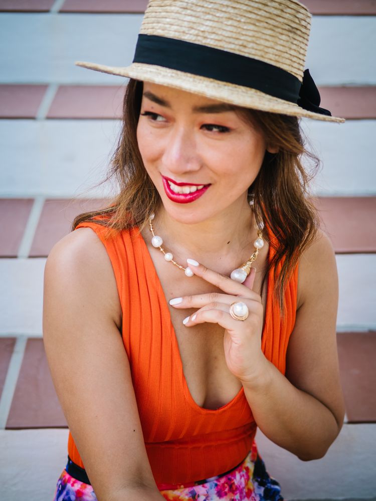young elegant Chinese woman at mediterranean scenario