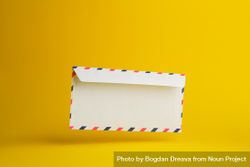 Floating envelope over light yellow background 4j68W4