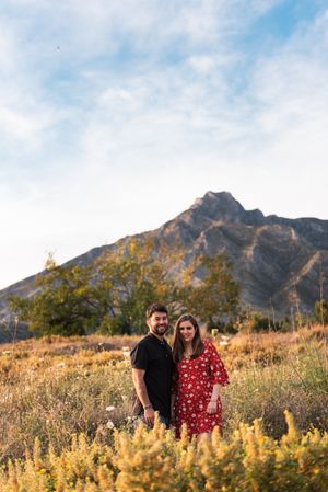 Young happy couple embracing in beautiful garden