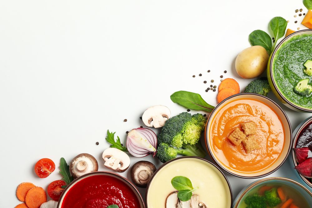 Colorful soups in corner of picture with copy space
