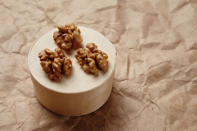Walnuts on wooden cheese box
