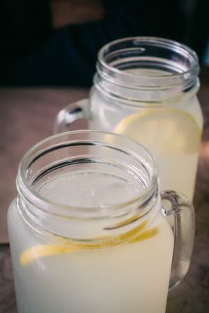 Glass cups with tasty lemonade