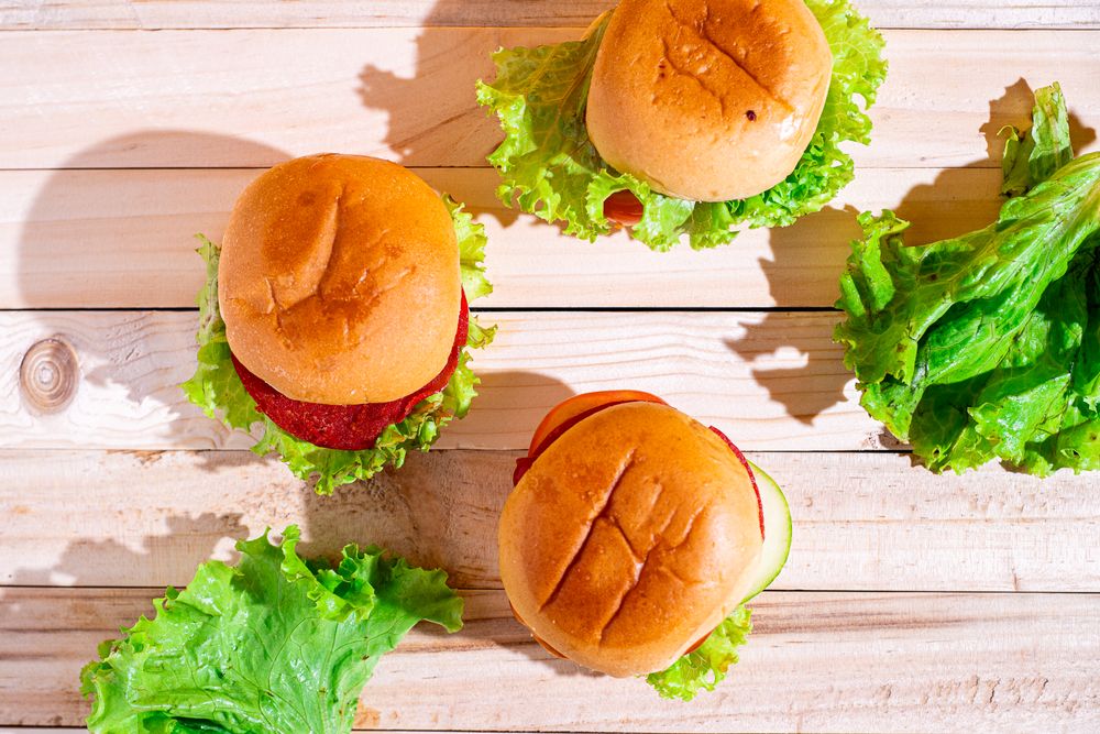 A sandwich with lettuce and tomato on top of a bun