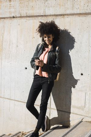 Black woman walking down the street.
