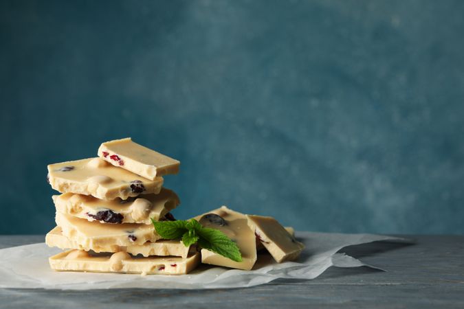 Pile of chocolate and mint on gray wooden table