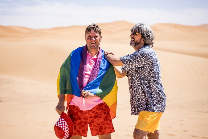 Excited gay couple in desert