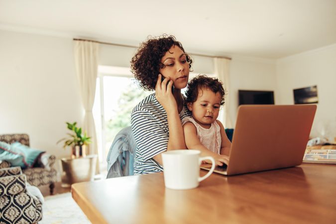 Working mother at home with baby