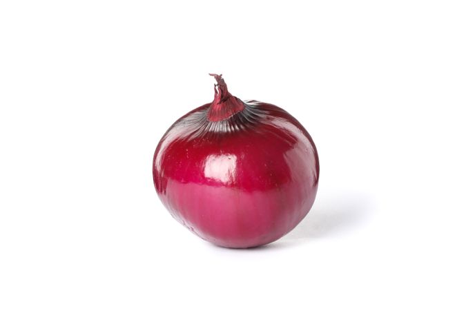 Fresh red onion isolated on plain background
