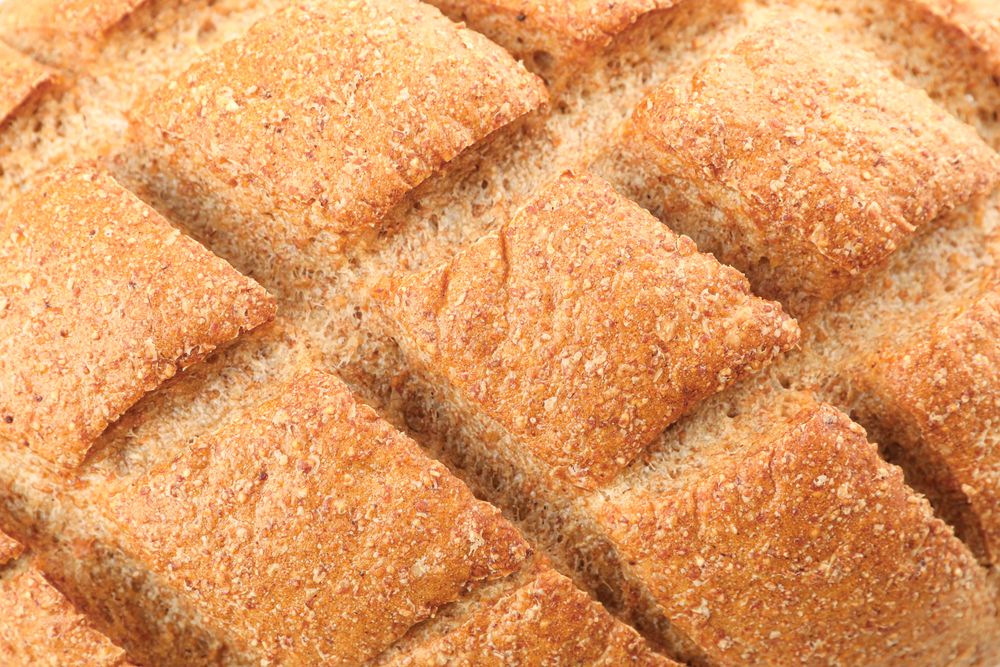 Wheat bread as background, closeup. Bakery products