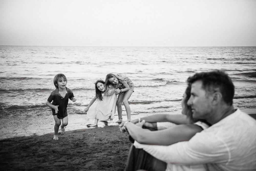 Beautiful happy family with children on beach