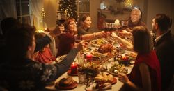 Parents, Children and Friends Spend Christmas Dinner Together at Home.