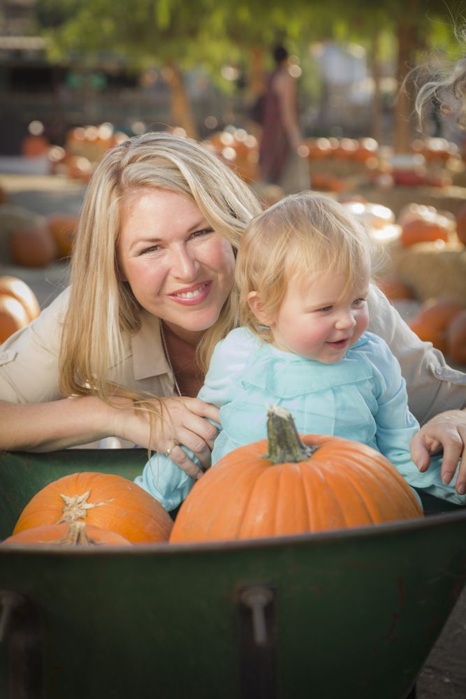 Mother and Daughter Enjoys the Pumpkin Patch