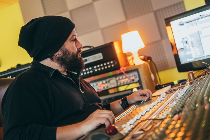 Man in a equalizer instrument in a studio