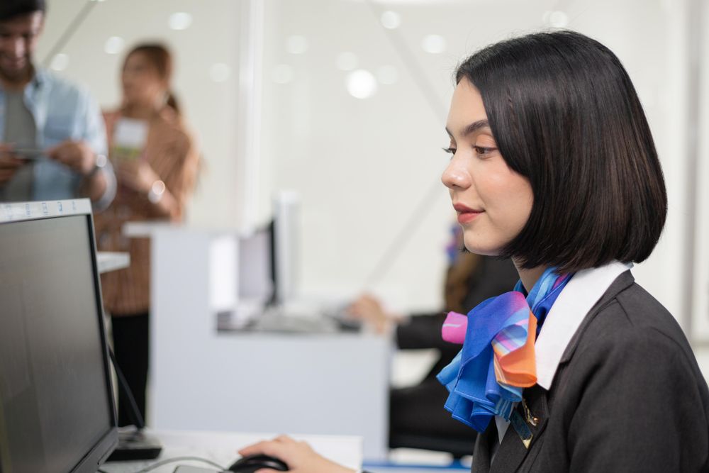 Female in silk scarf flight attendant uniform working in airport