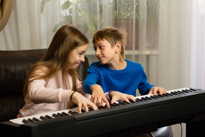 Siblings' Piano Time at Home