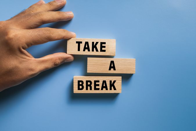 take a break words on wooden blocks isolated on blue background