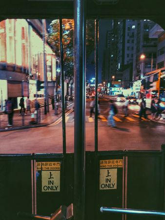 People walking down the street at night