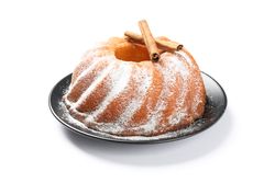 Cake with powder sugar and cinnamon isolated on blank background