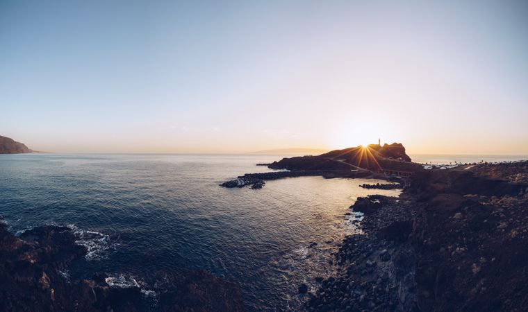Remote rocky seaside at bright sunset