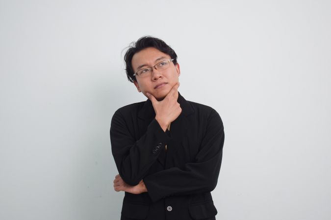 Thoughtful Asian businessman