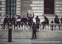 London, England, United Kingdom - June 6th, 2020: BLM protesters sitting along wall 47mWk0