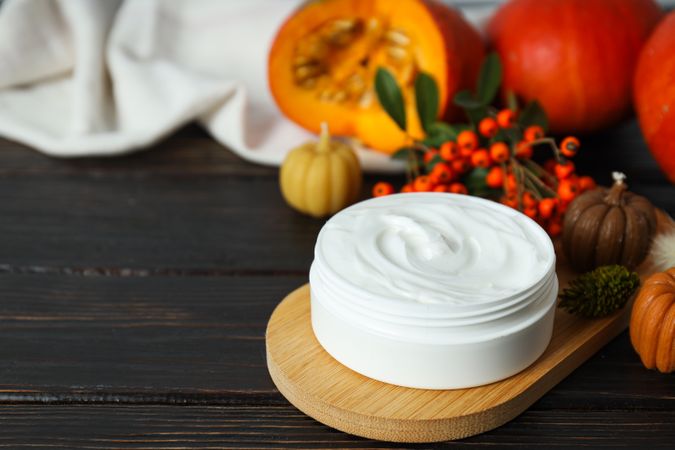 Skin care and face care concept - pumpkin cosmetic