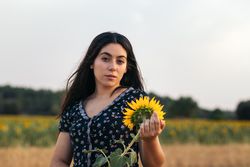 Portrait of a young woman with long hair in the countryside