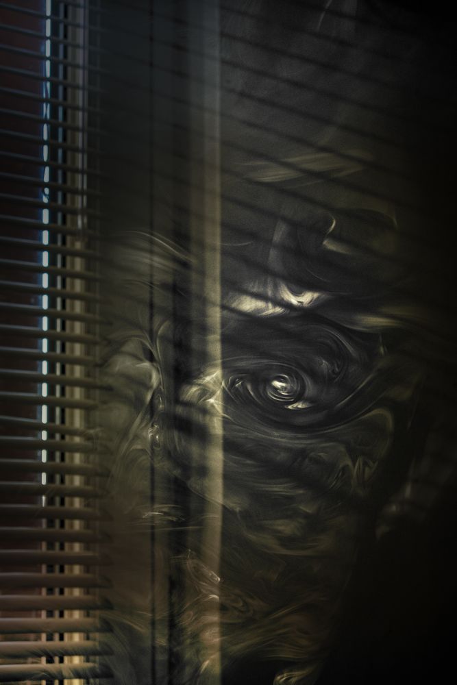 Smoke swirling in dark room